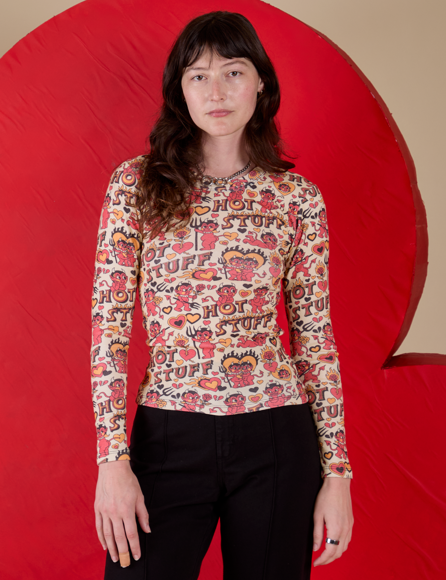 Alex is 5’8” and wearing P Long Sleeve Baby Tee in Hot Stuff Print