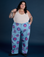 Sam is 5’10” and wearing 4XL Floral Painted Work Pants in Blue paired with a Tank Top in Vintage Tee Off-White