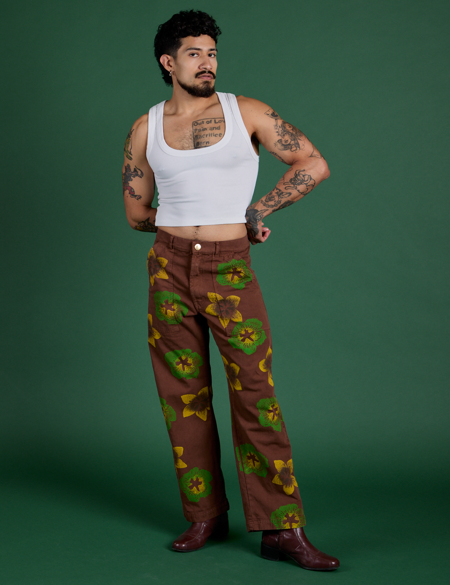 Jesse is 5’7” and wearing S Floral Painted Work Pants in Brown paired with a Cropped Tank in Vintage Tee White