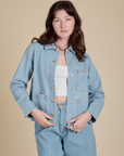 Alex is 5'8" and wearing P Indigo Denim Work Jacket in Light Wash