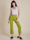 Alex is 5’8” and wearing XS Work Pants in Gross Green paired with vintage tee white Cropped Tank