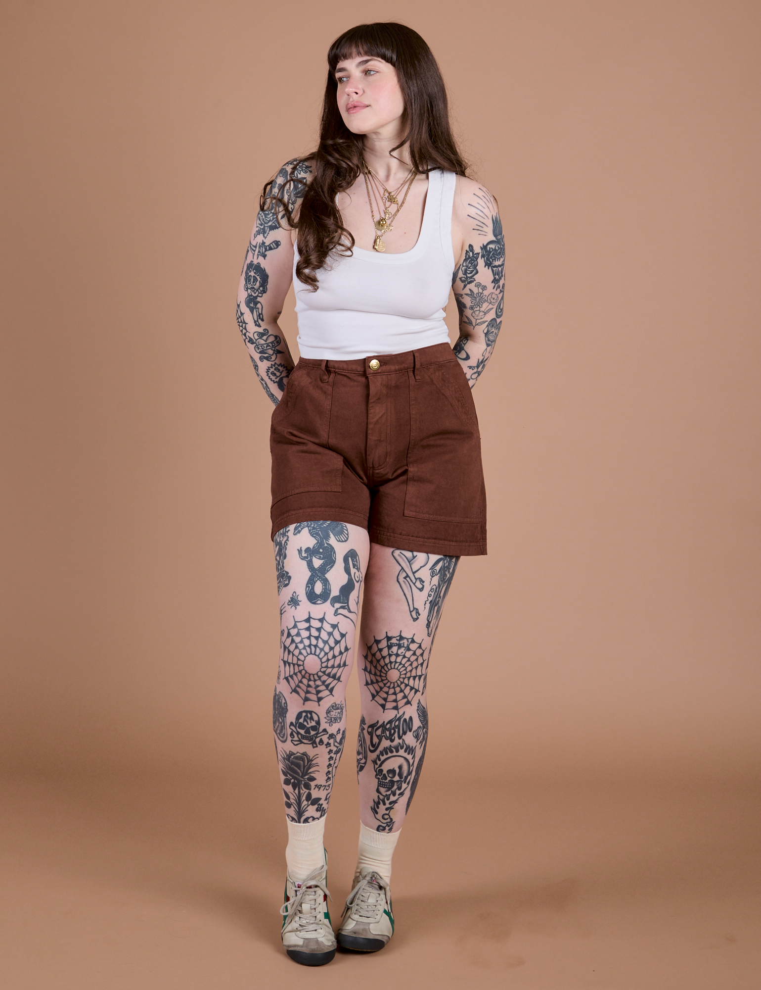 Sydney is 5’9” and wearing M Classic Work Shorts in Fudgesicle Brown paired with the Cropped Tank in Vintage Tee White
