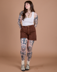 Sydney is 5’9” and wearing M Classic Work Shorts in Fudgesicle Brown paired with the Cropped Tank in Vintage Tee White