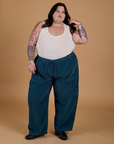 Sam is 5'10" and wearing 2XL Corduroy Drop Pocket Cargo Pants in Lagoon paired with a Tank Top in Vintage Tee Off-White