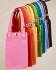 An array of Cell Phone Totes hanging on a rod