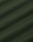 Baby Tee in Swamp Green fabric detail close up