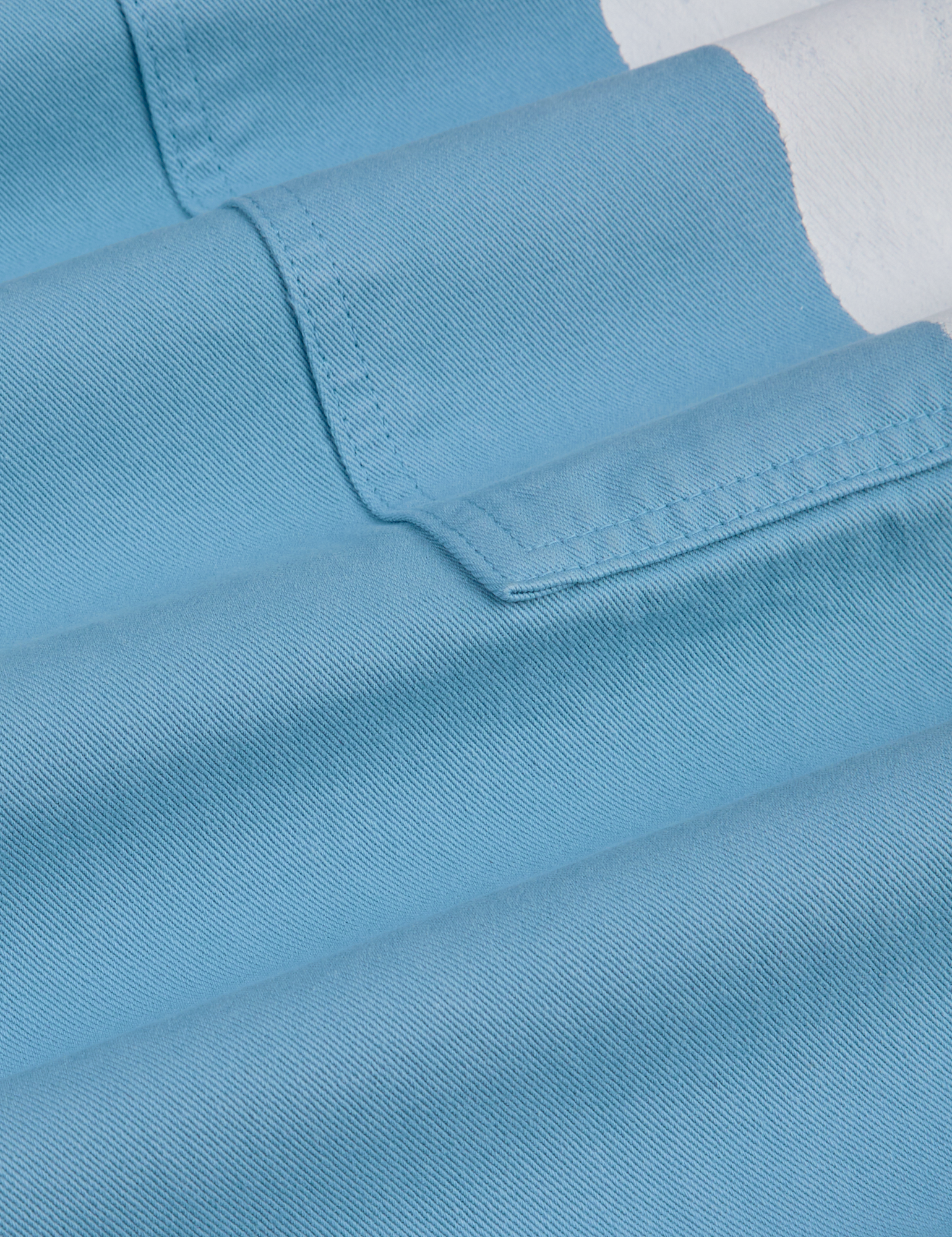 Painted Drop Pocket Cargo Pants in Baby Blue fabric detail close up