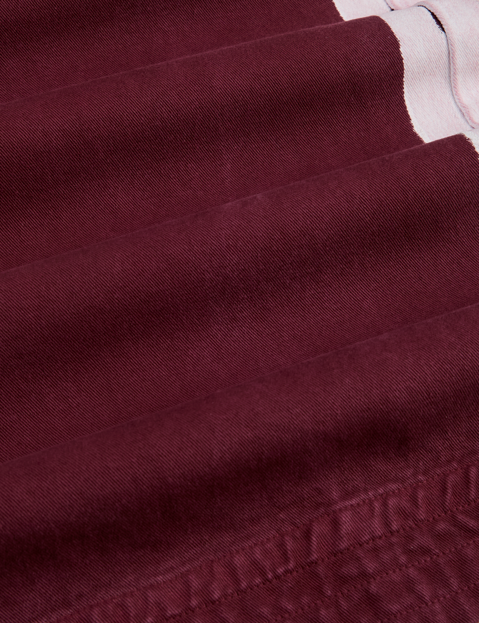 Painted Action Pants in Red Wine fabric detail close up
