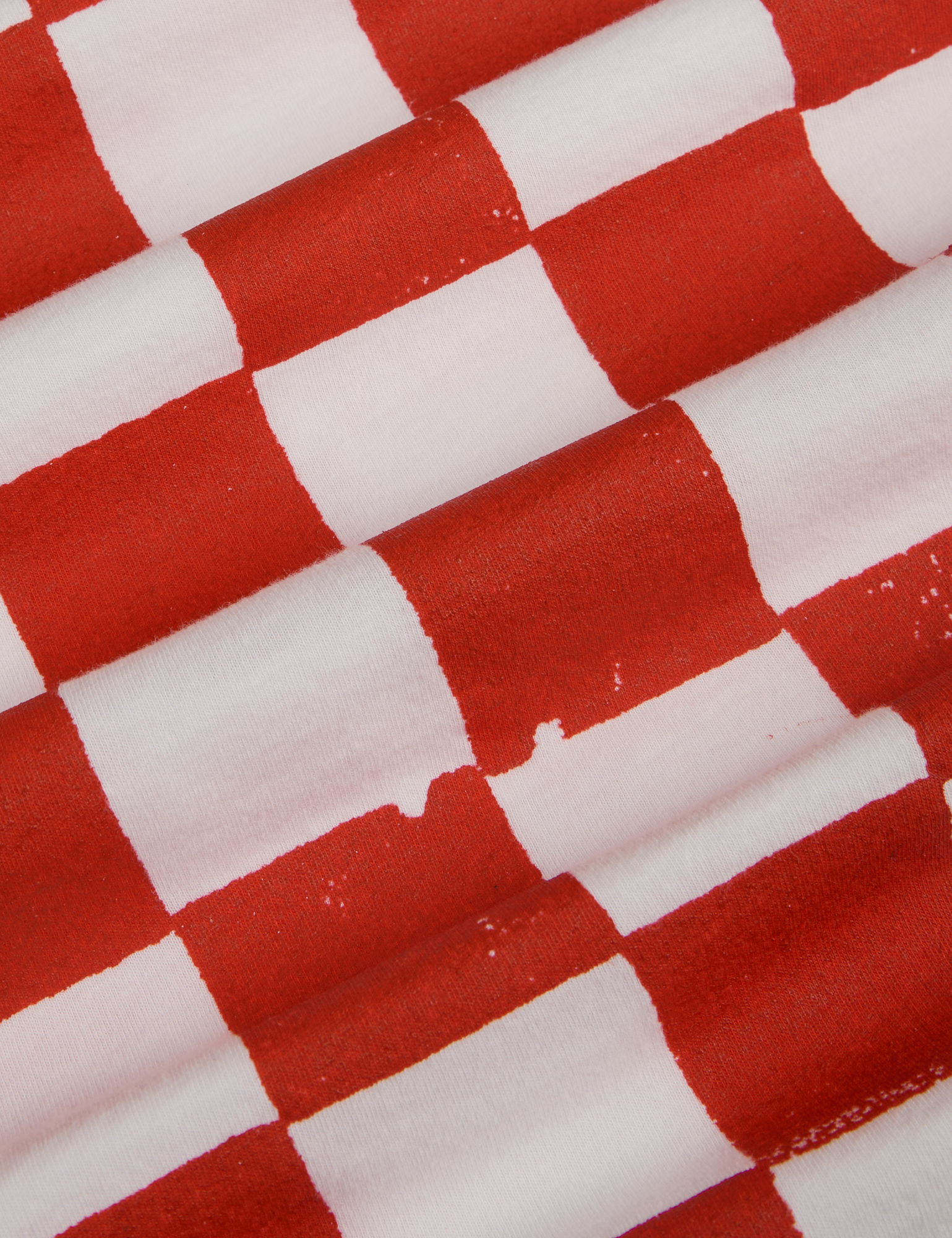 Checker Organic Tee in Red fabric detail close up