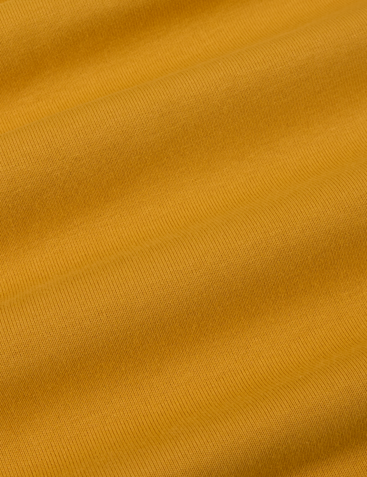 Cropped Tank Top in Mustard Yellow fabric detail close up