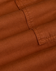 Drop Pocket Cargo Pants in Burnt Terracotta fabric detail close up