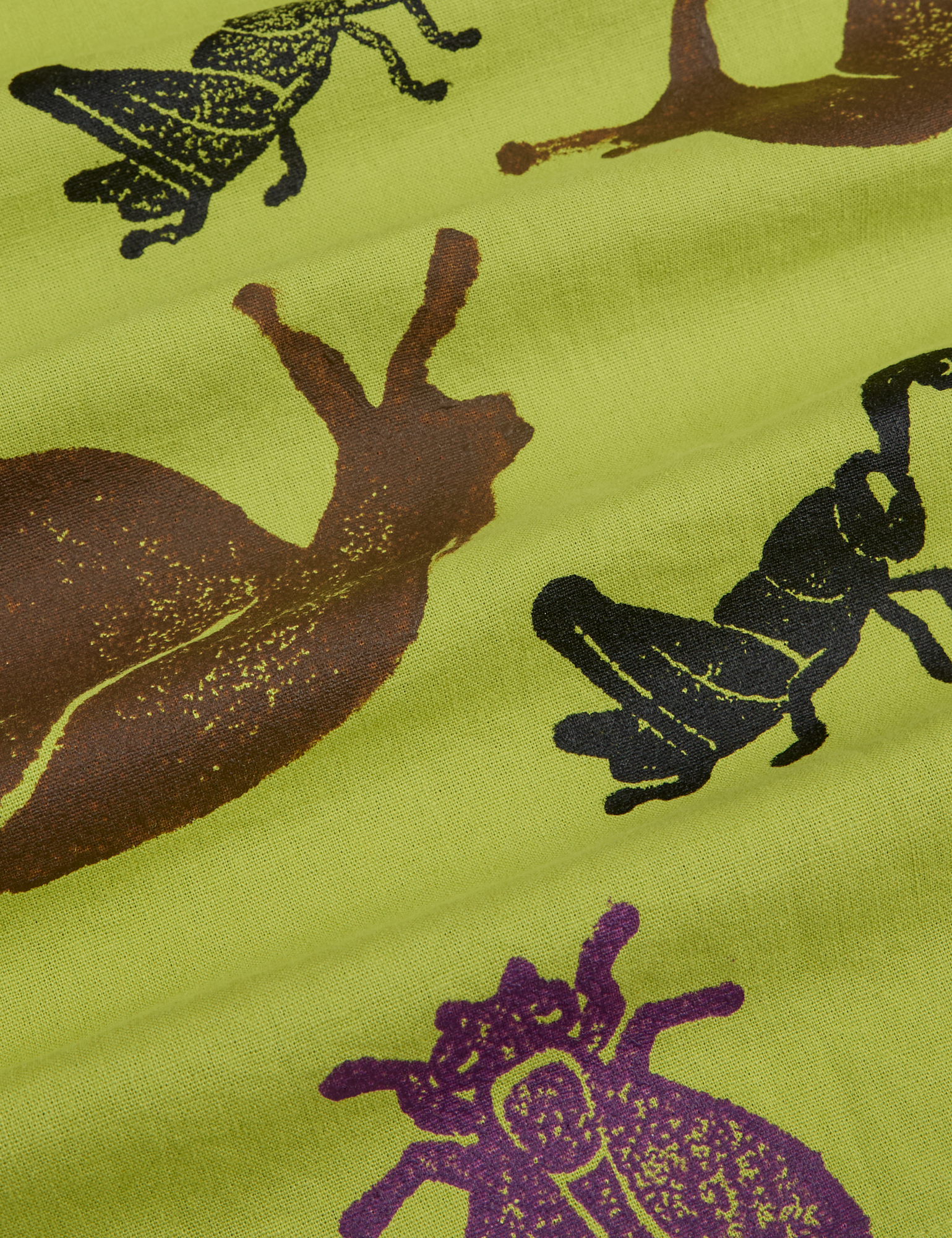 Paintstamped Pantry Button-Up in Big Bug close up. Gross Green with brown, black and purple stamped bugs