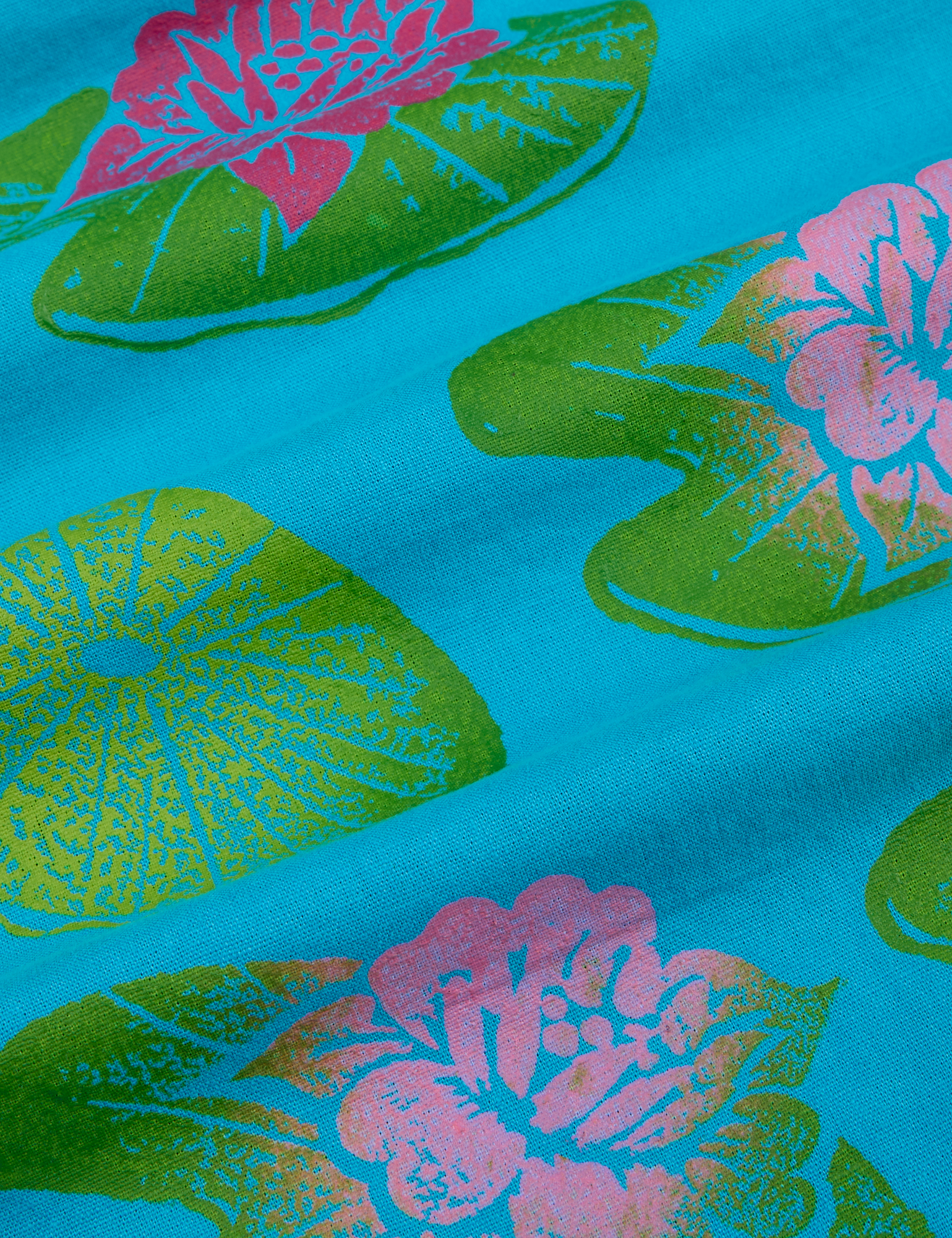 Paintstamped Pantry Button-Up in Lilypad close up. Green lilypads with pink flowers
