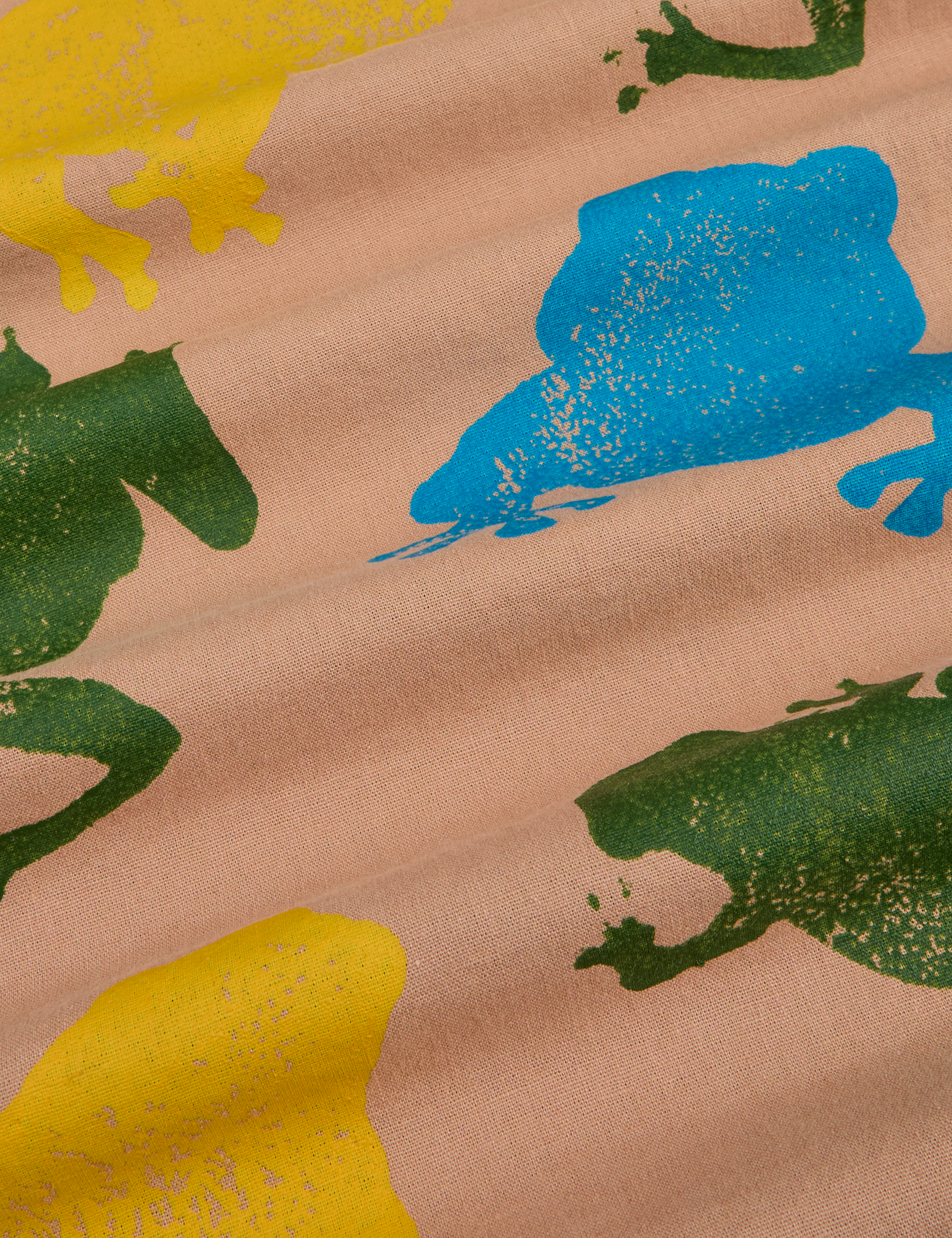 Paintstamped Pantry Button-Up in Froggy close up of blue, green and yellow stamped frogs