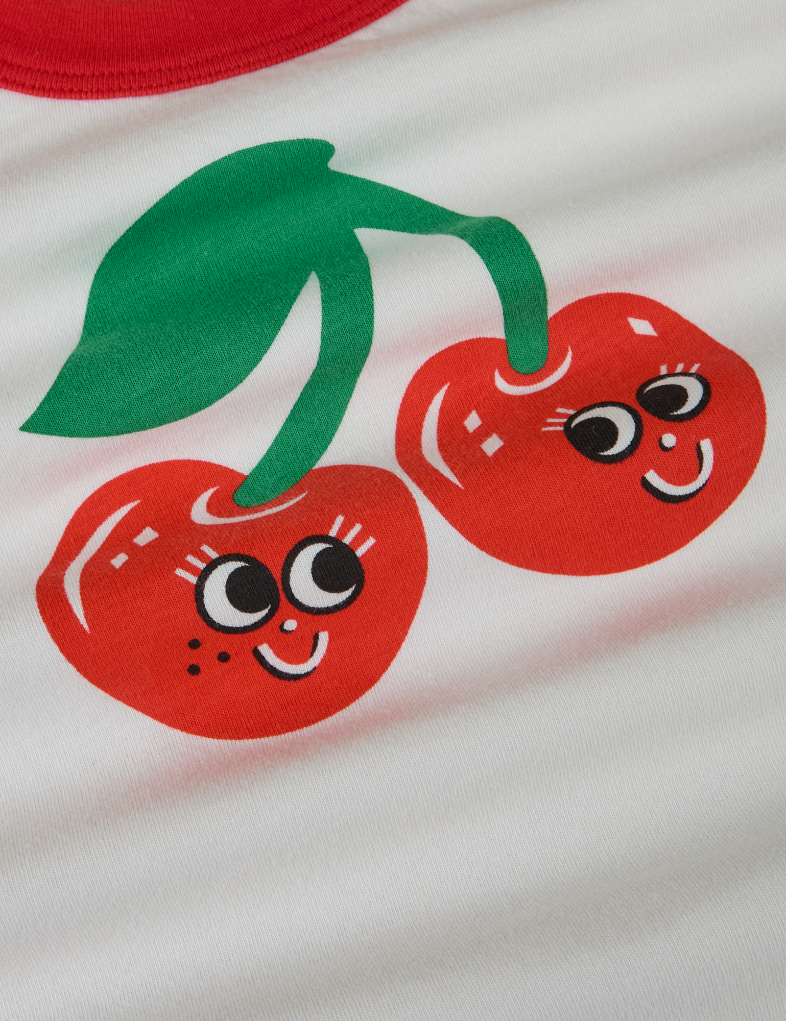 Produce Raglan Tee in Cherry close up. A pair of illustrated cherries.