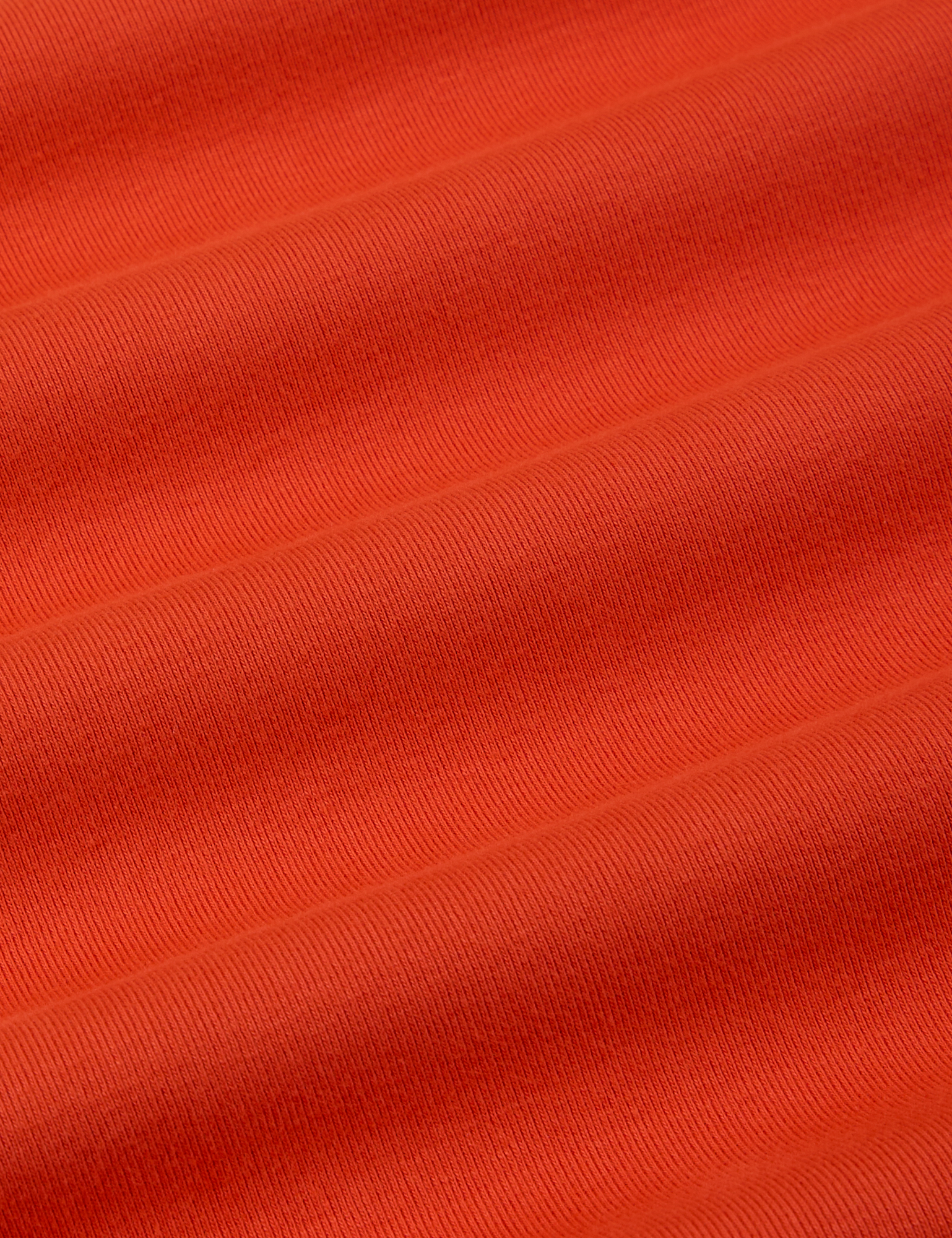 Long Sleeve Baby Tee in Chili Red fabric detail close up
