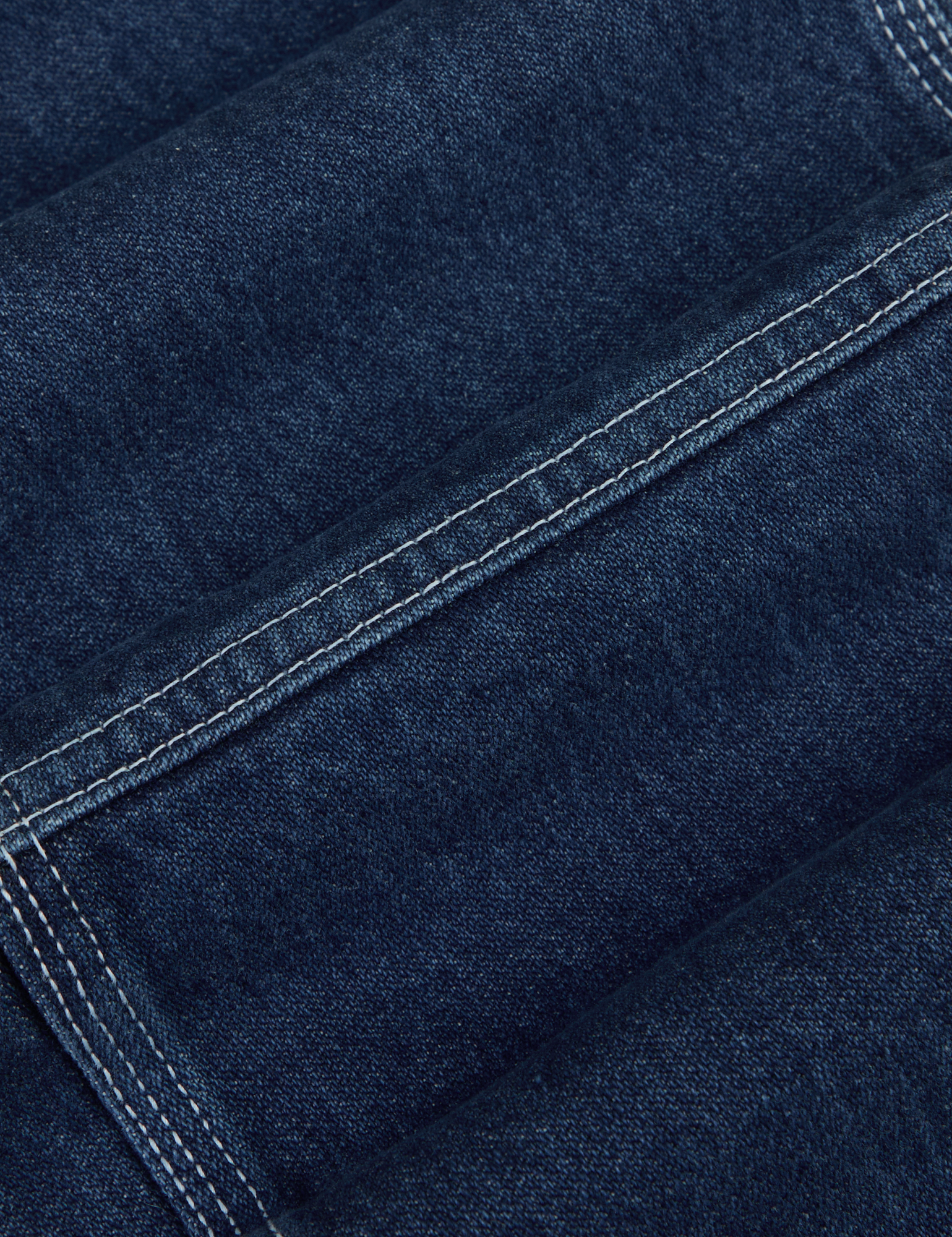 Mid-Rise Carpenter Jeans in Dark Wash fabric detail close up