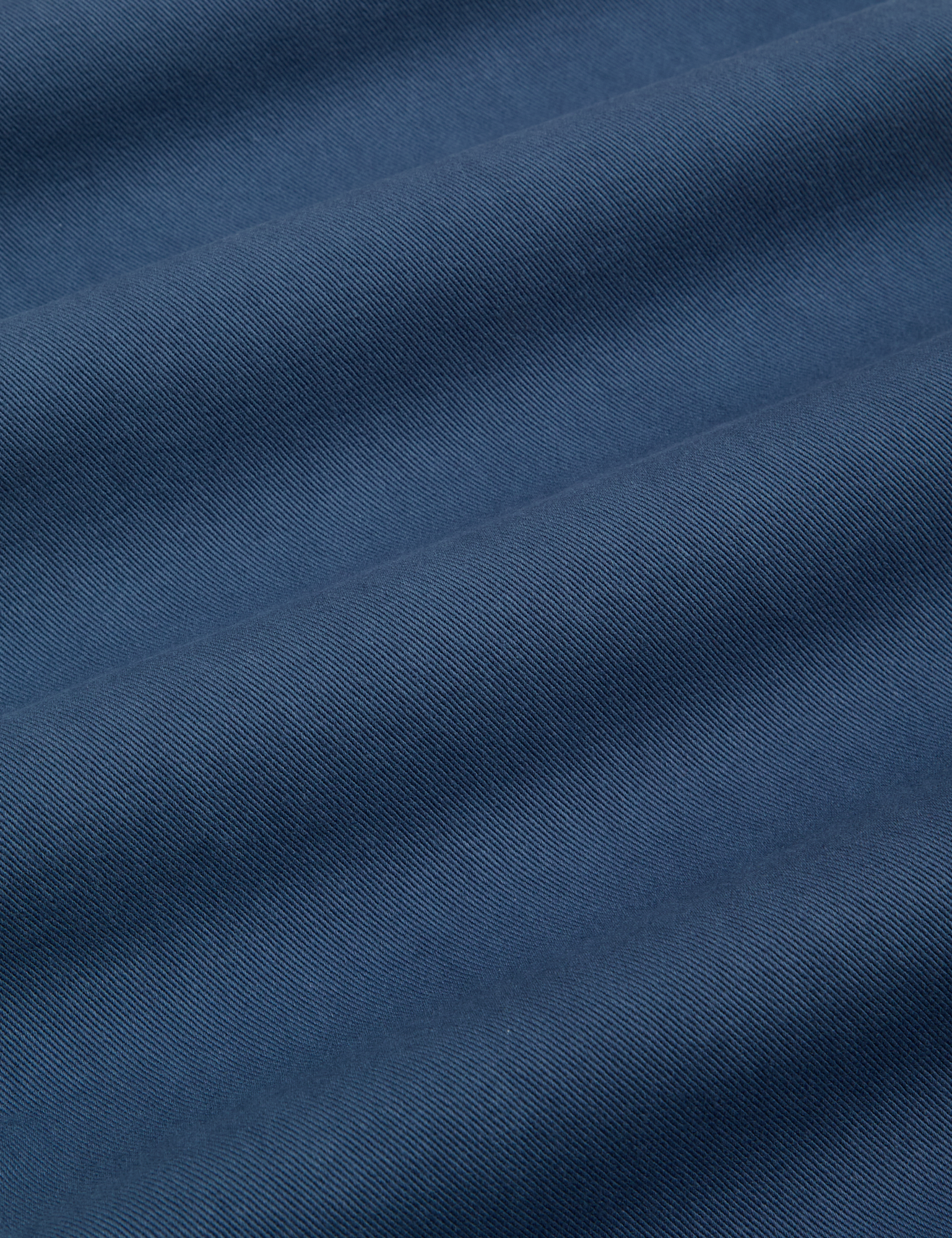 Baggy Mid-Rise Trousers in French Blue fabric detail close up