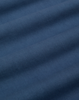 Baggy Mid-Rise Trousers in French Blue fabric detail close up