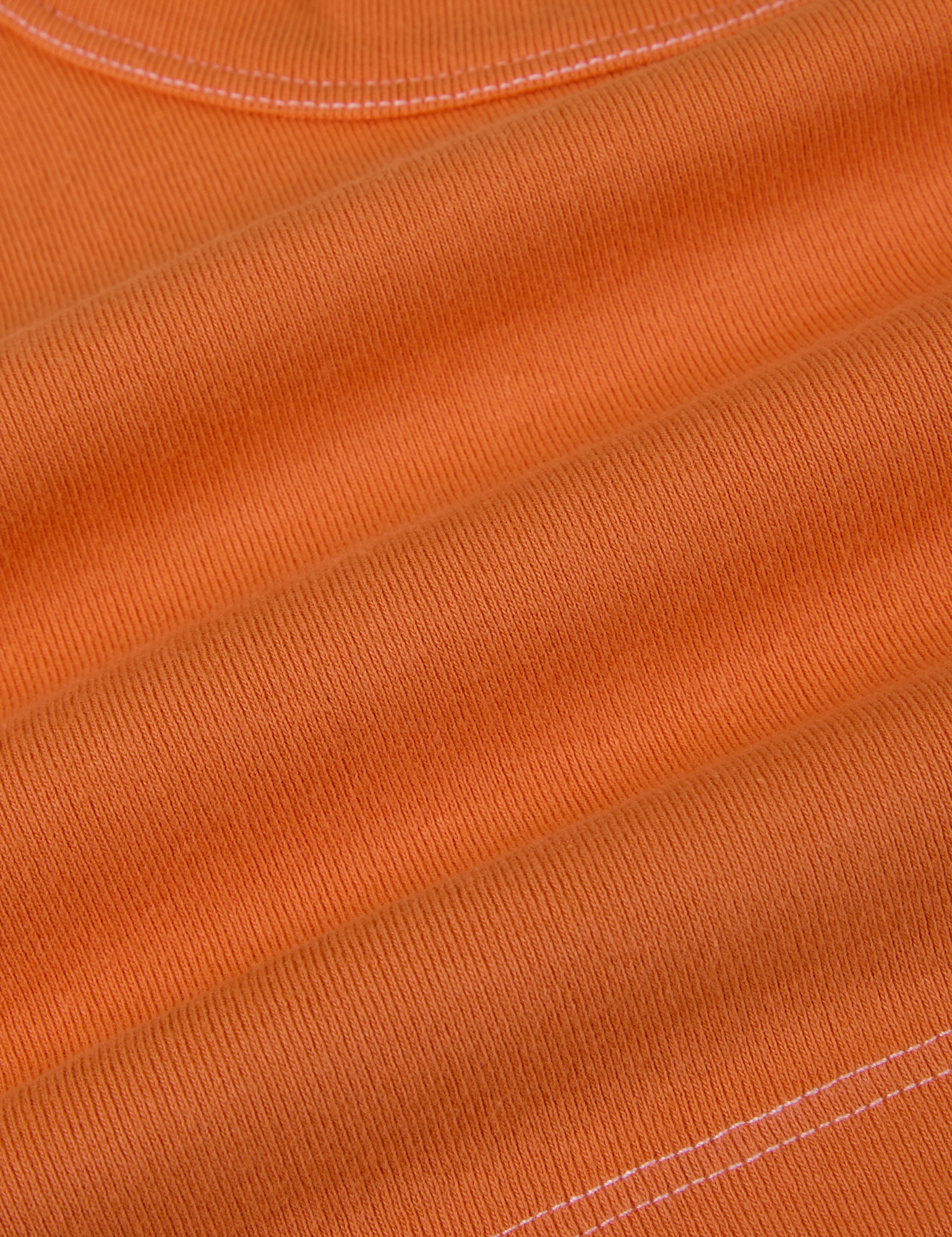 Contrast Stitch Mini Tank in Construction Orange fabric detail close up with white topstitching