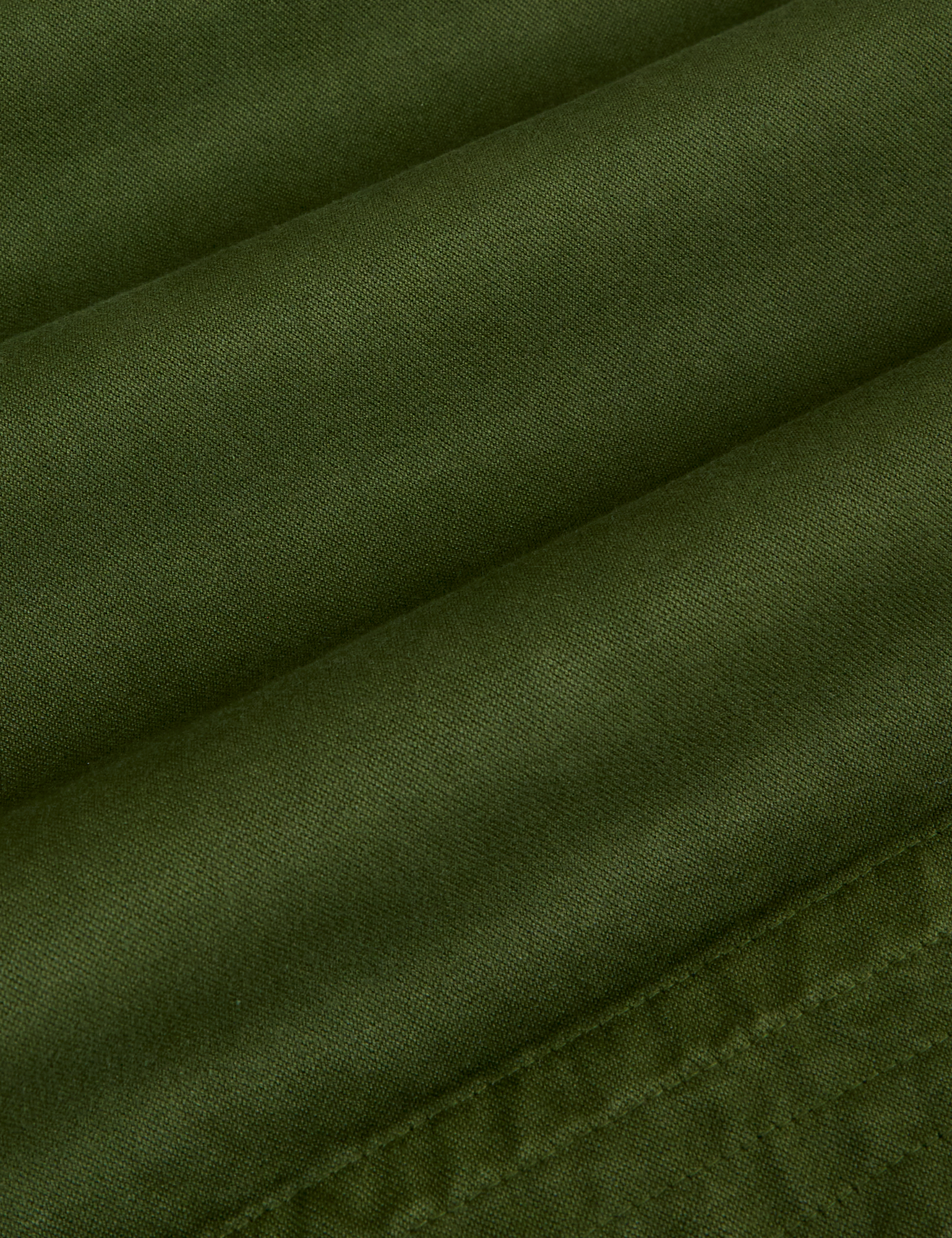 Organic Action Pants in Evergreen fabric detail close up
