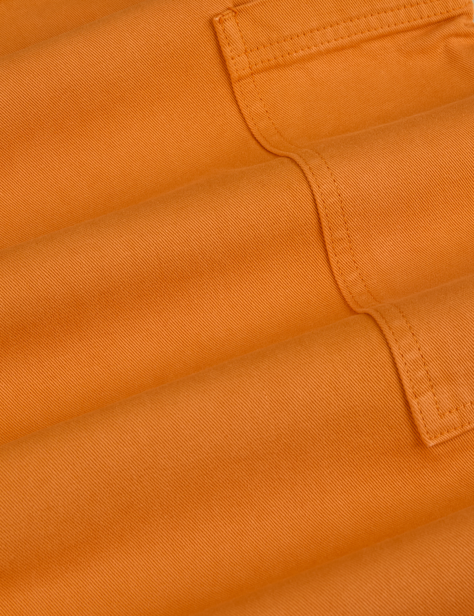 Drop Pocket Cargo Pants in Creamsicle Orange fabric detail close up