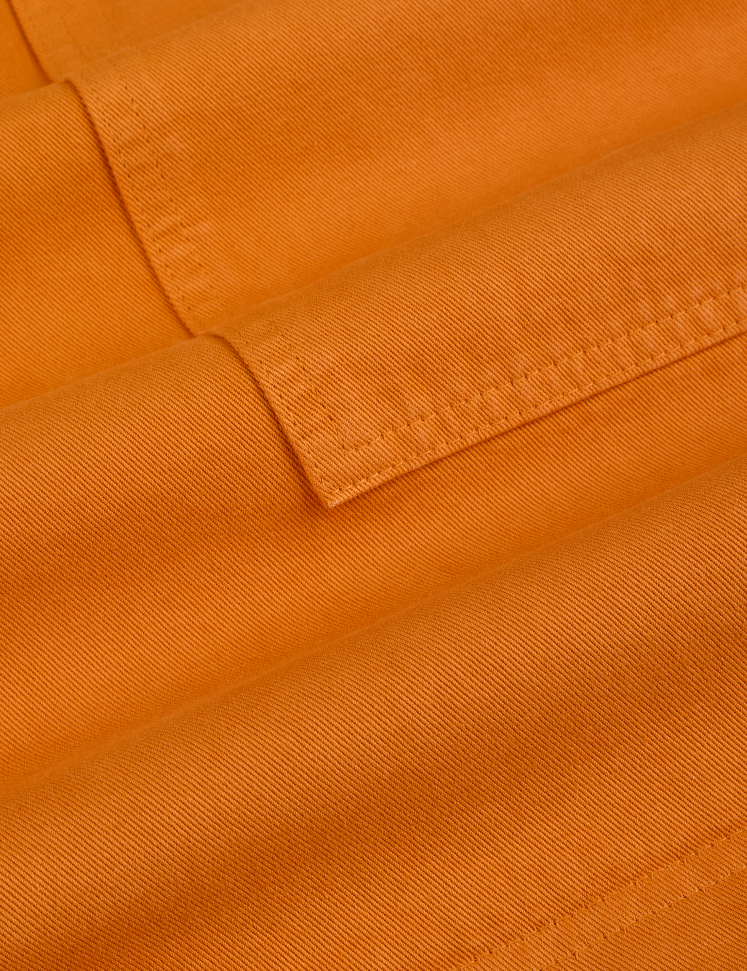 Longline Work Shorts in Creamsicle Orange fabric detail close up