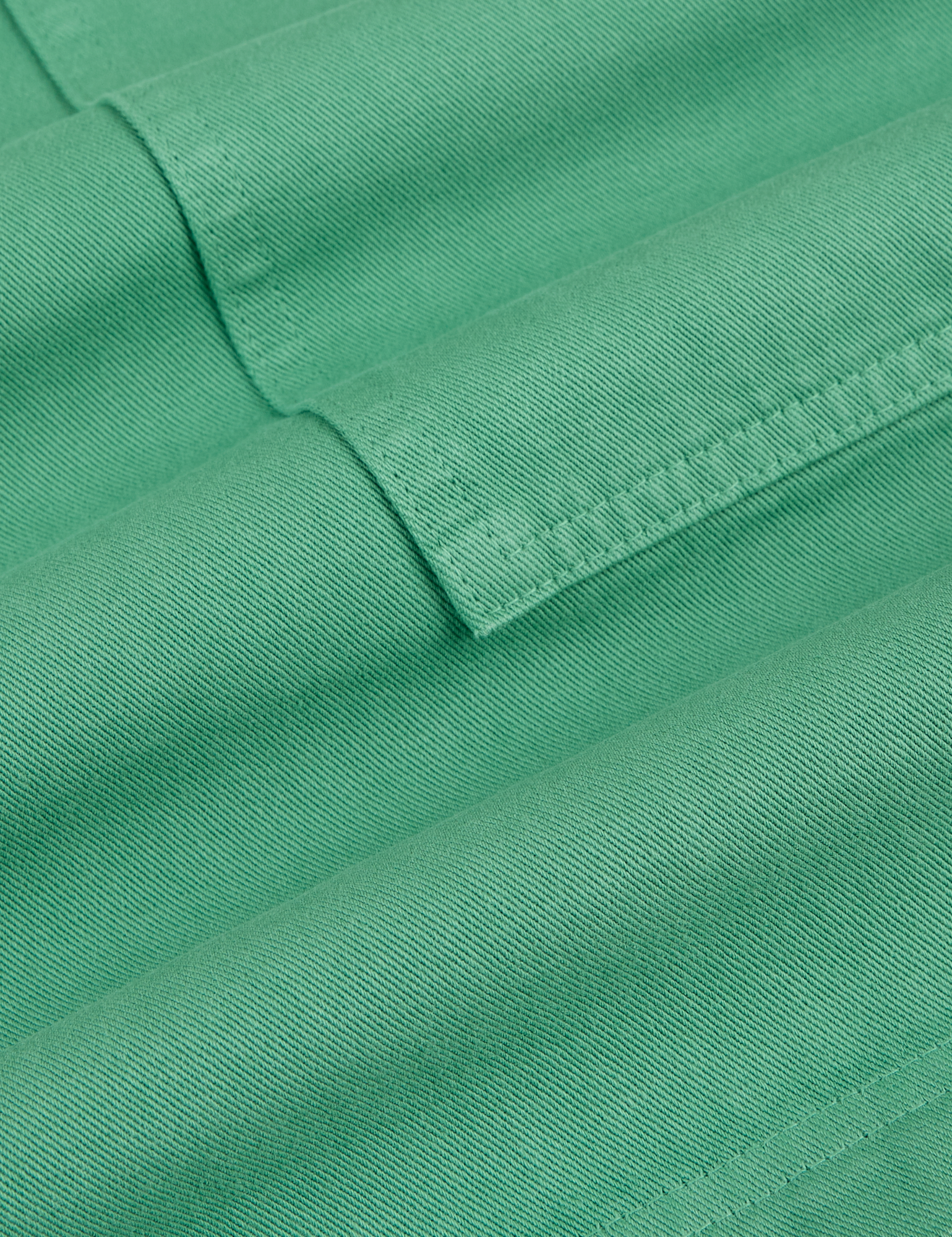 Longline Work Shorts in Seafoam Green fabric detail close up