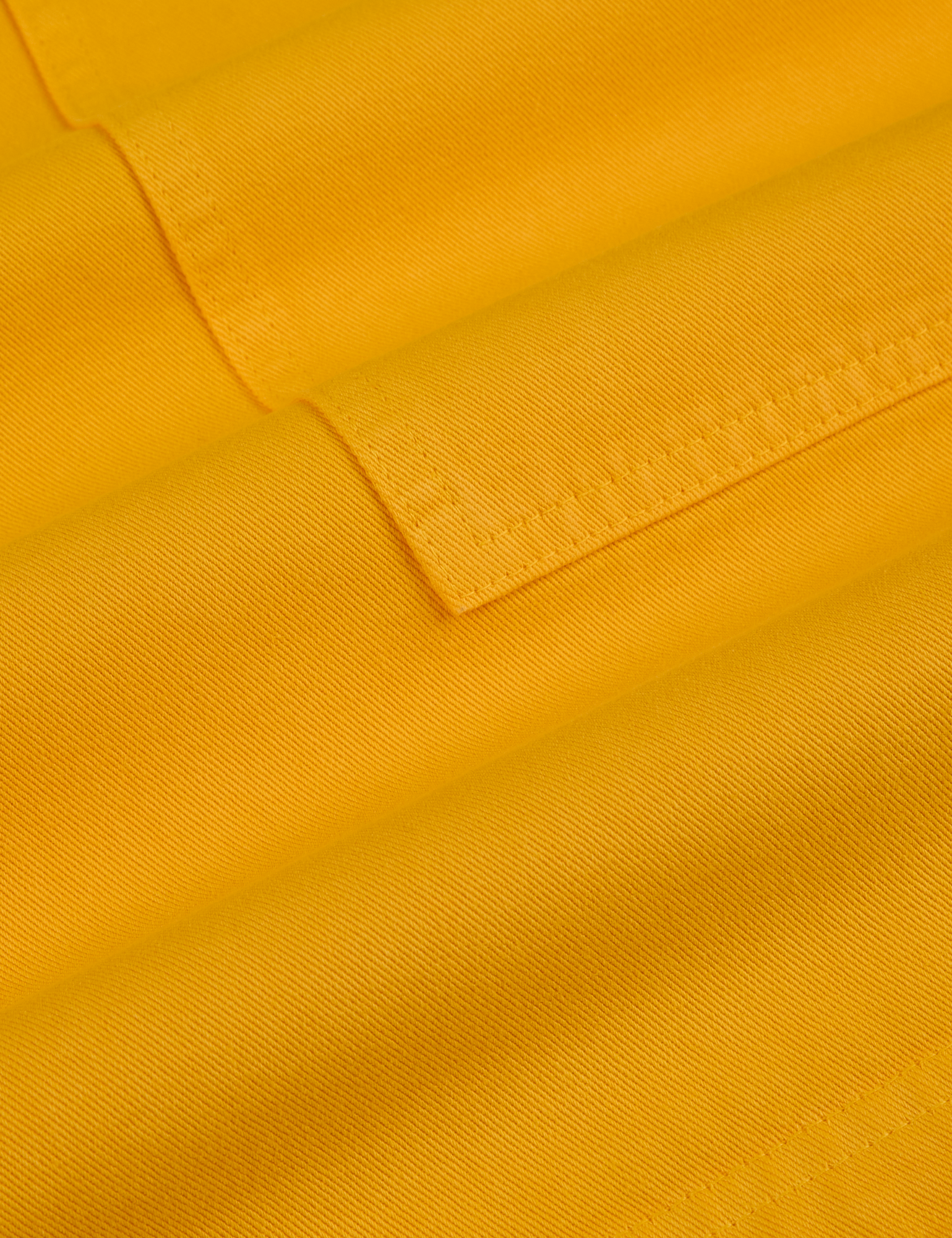 Longline Work Shorts in Sunshine Yellow fabric detail close up