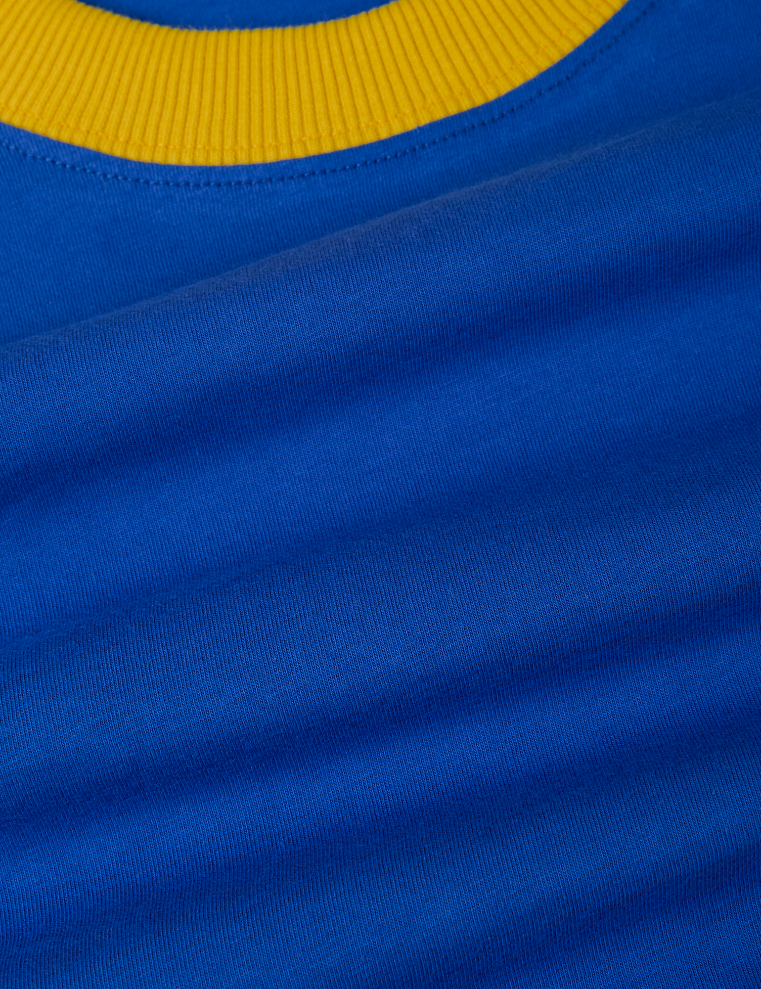 Vintage Ringer Tee in Royal Blue fabric detail close up with sunshine yellow neckline