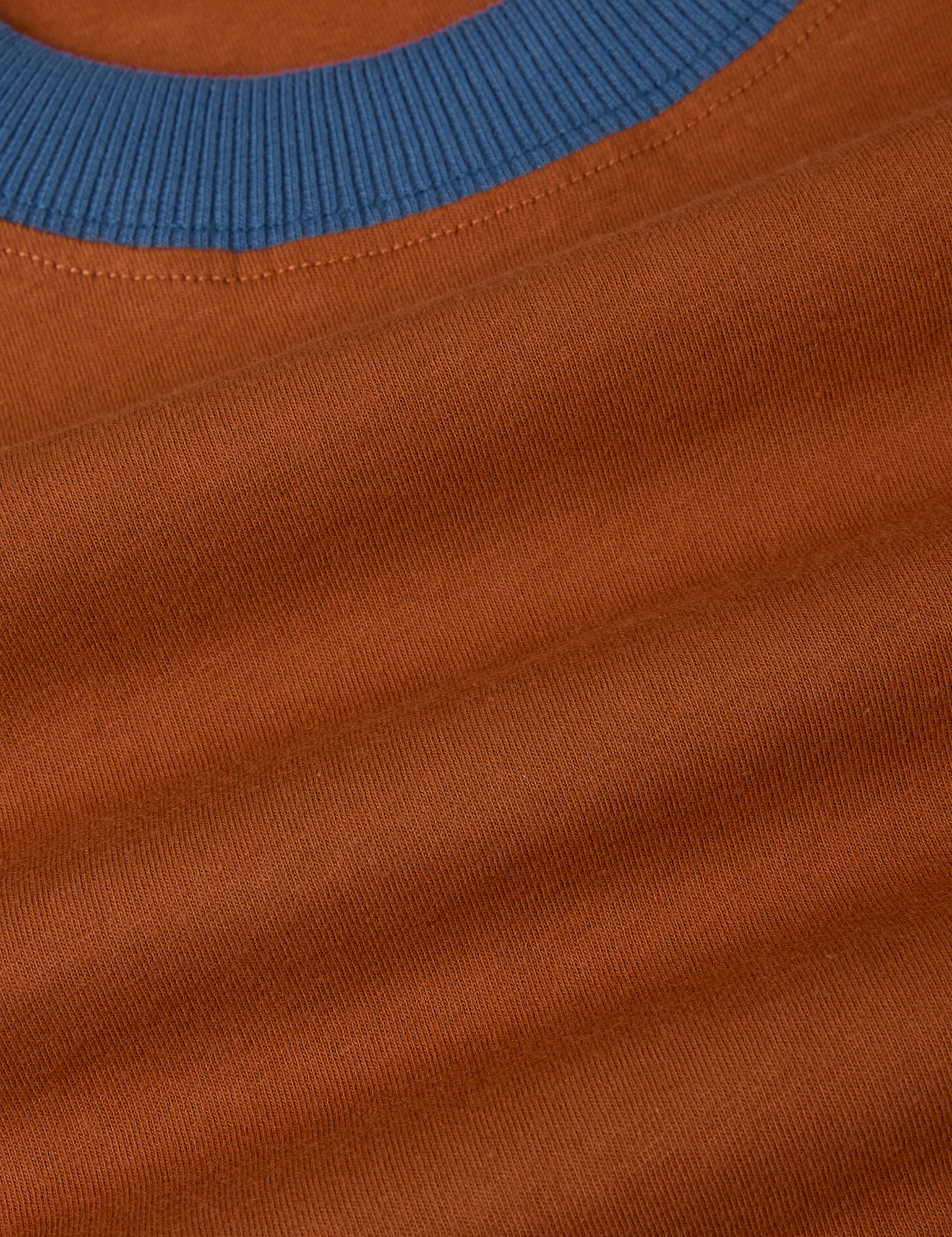 Vintage Ringer Tee in Burnt Terracotta fabric detail close up with french blue neckline