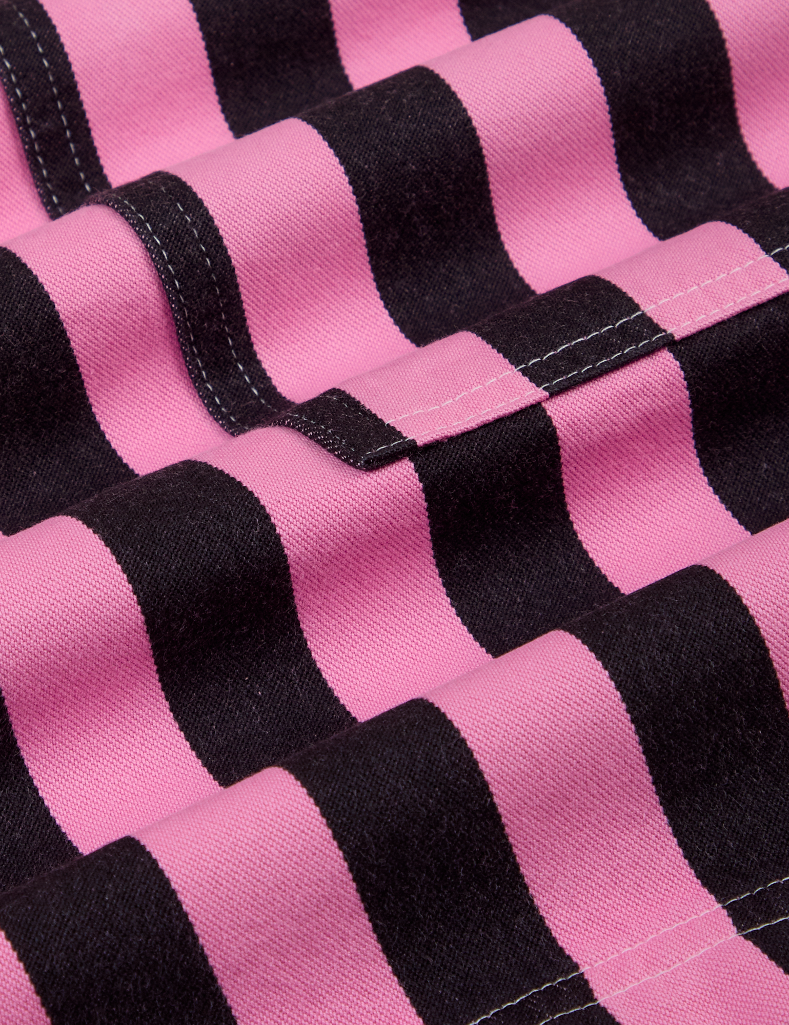 Longline Work Shorts in Bubblegum Pink and black stripe fabric close up