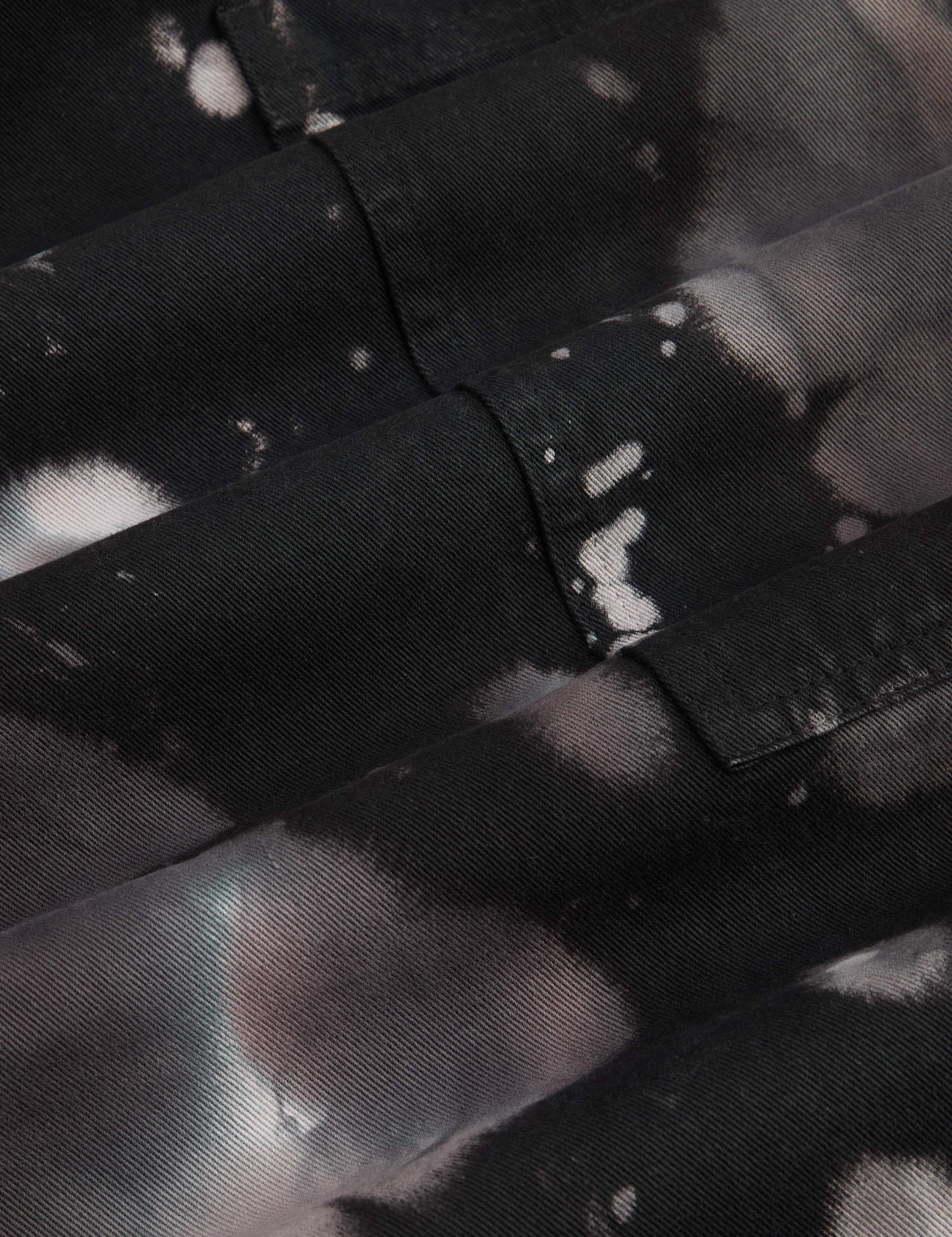 Magic Waters Drop Pocket Pants in Ink Blot fabric detail close up. Black, white and shades of grey tie dye.