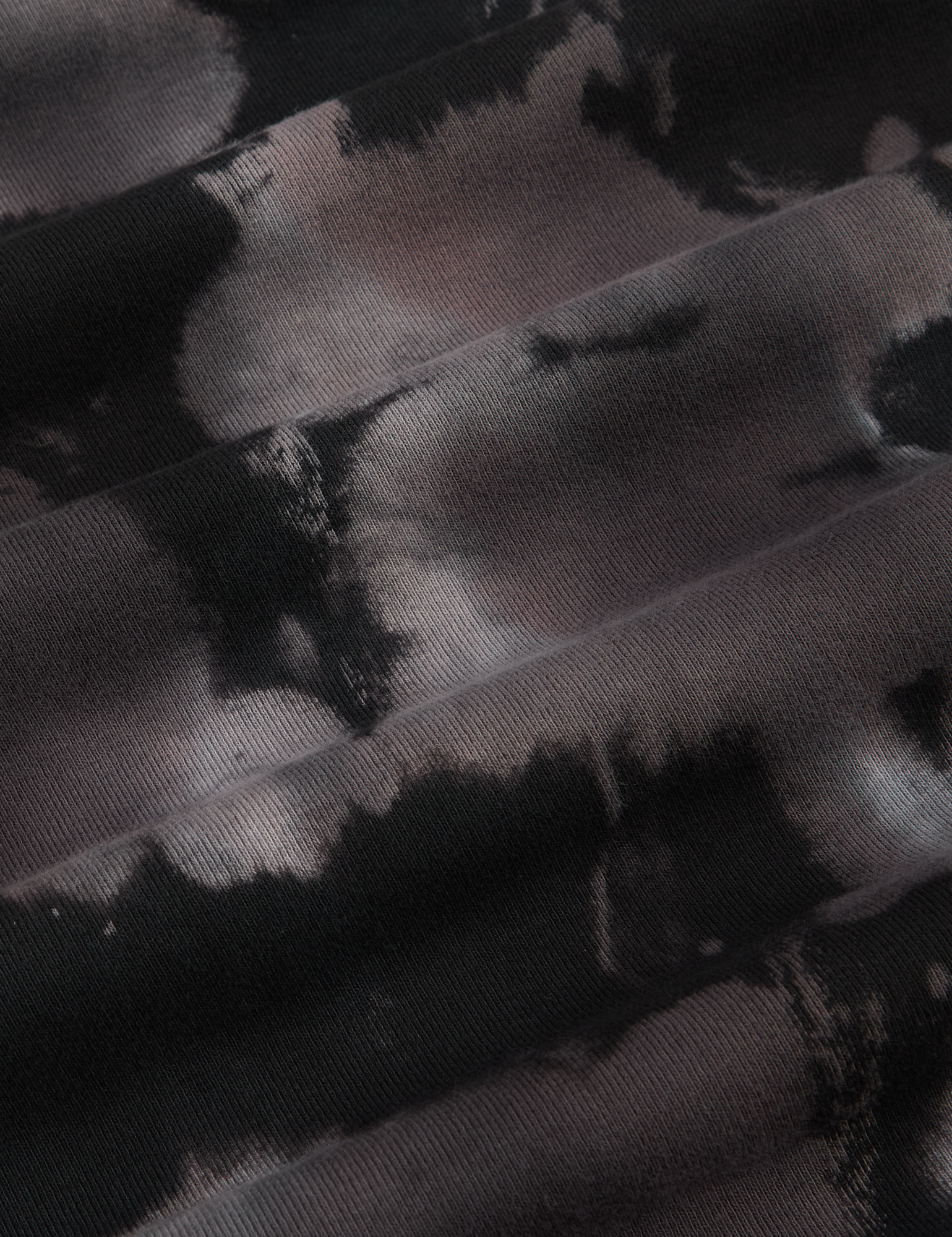 Long Sleeve Baby Tee in Ink Blot fabric detail close up. Black and grey tie dye