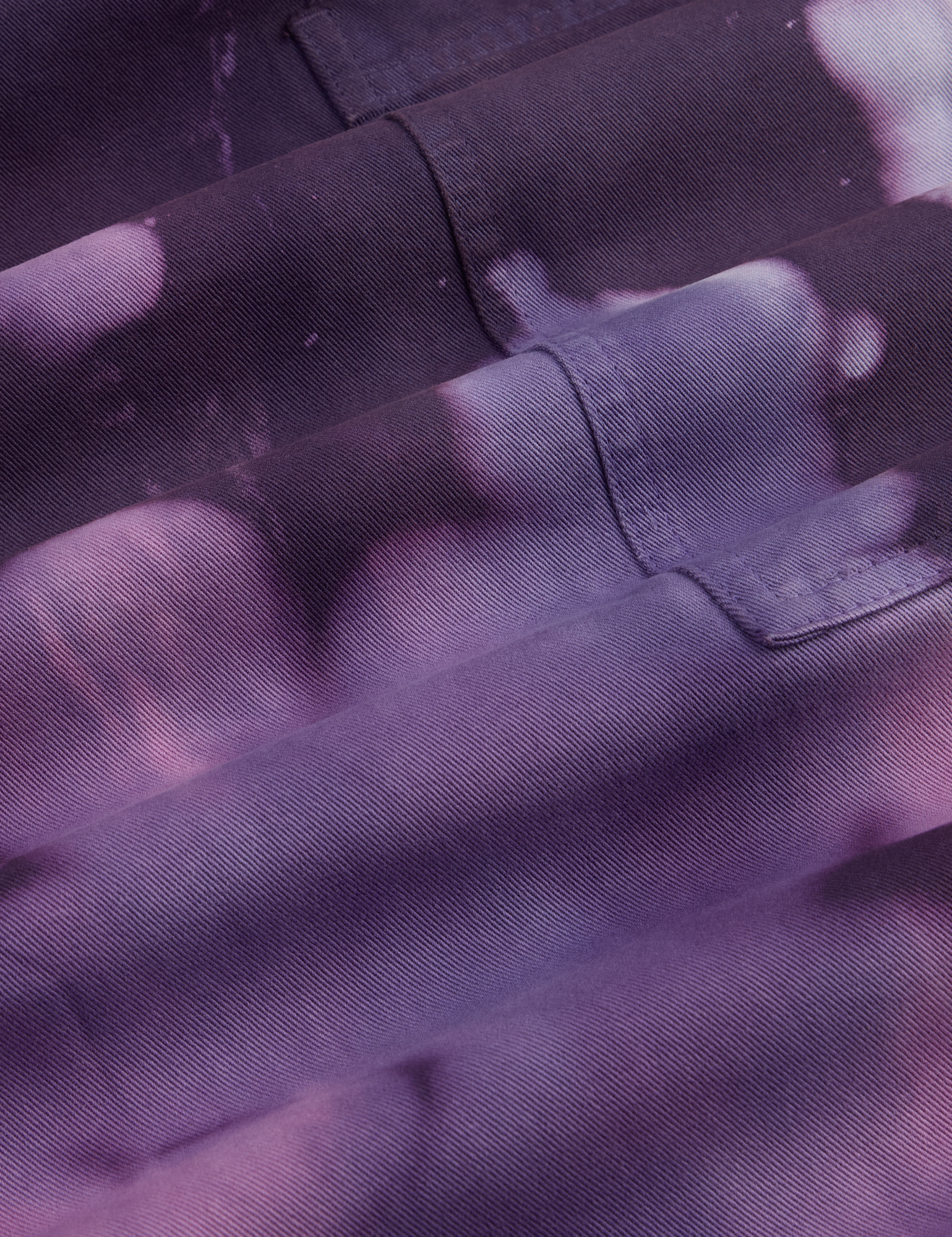 Magic Waters Drop Pocket Pants in Dark Lavender fabric detail close up. Tie dye in shades of purple.