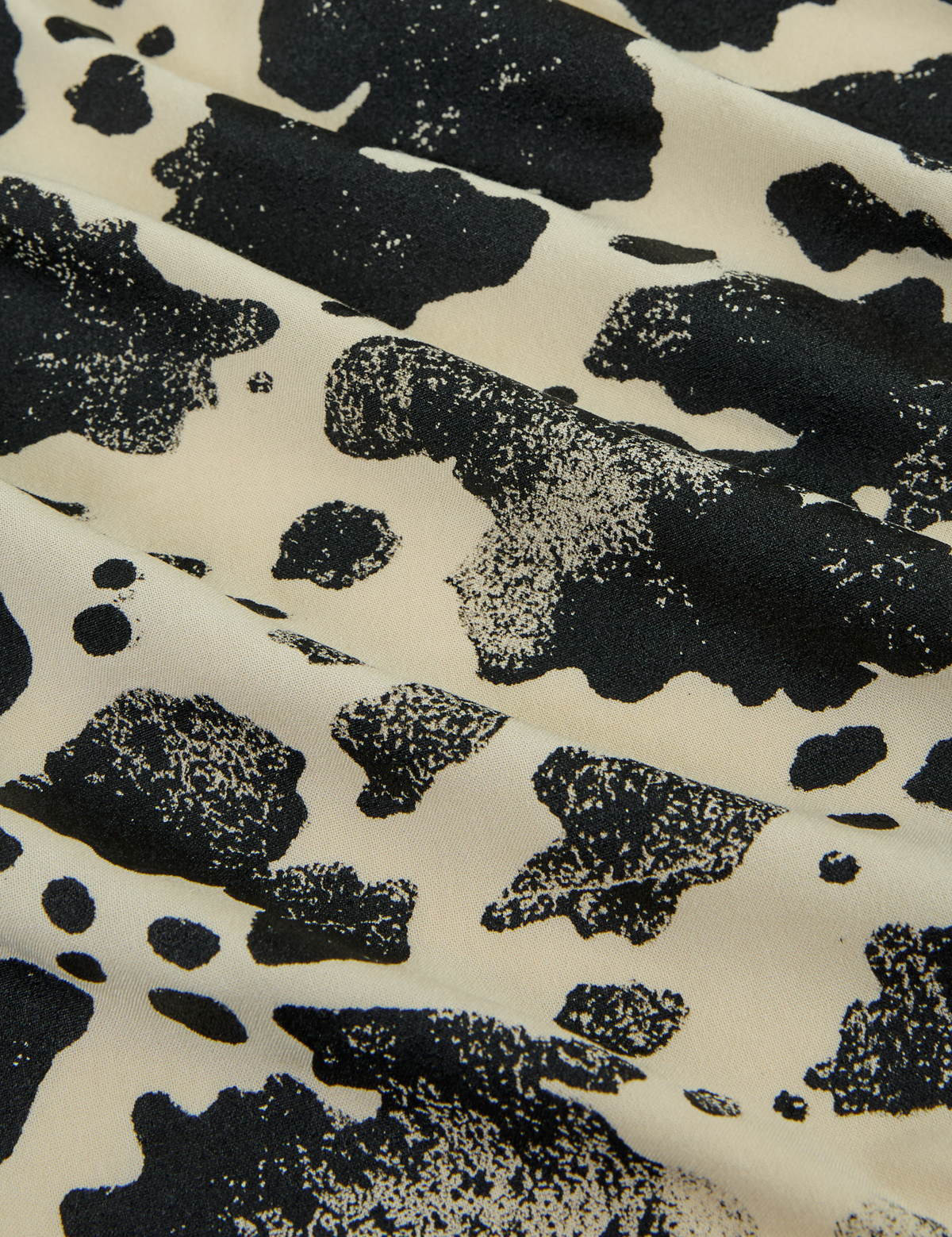 Fabric close up of the Cow Pantry Button Up