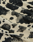 Fabric close up of the Cow Pantry Button Up