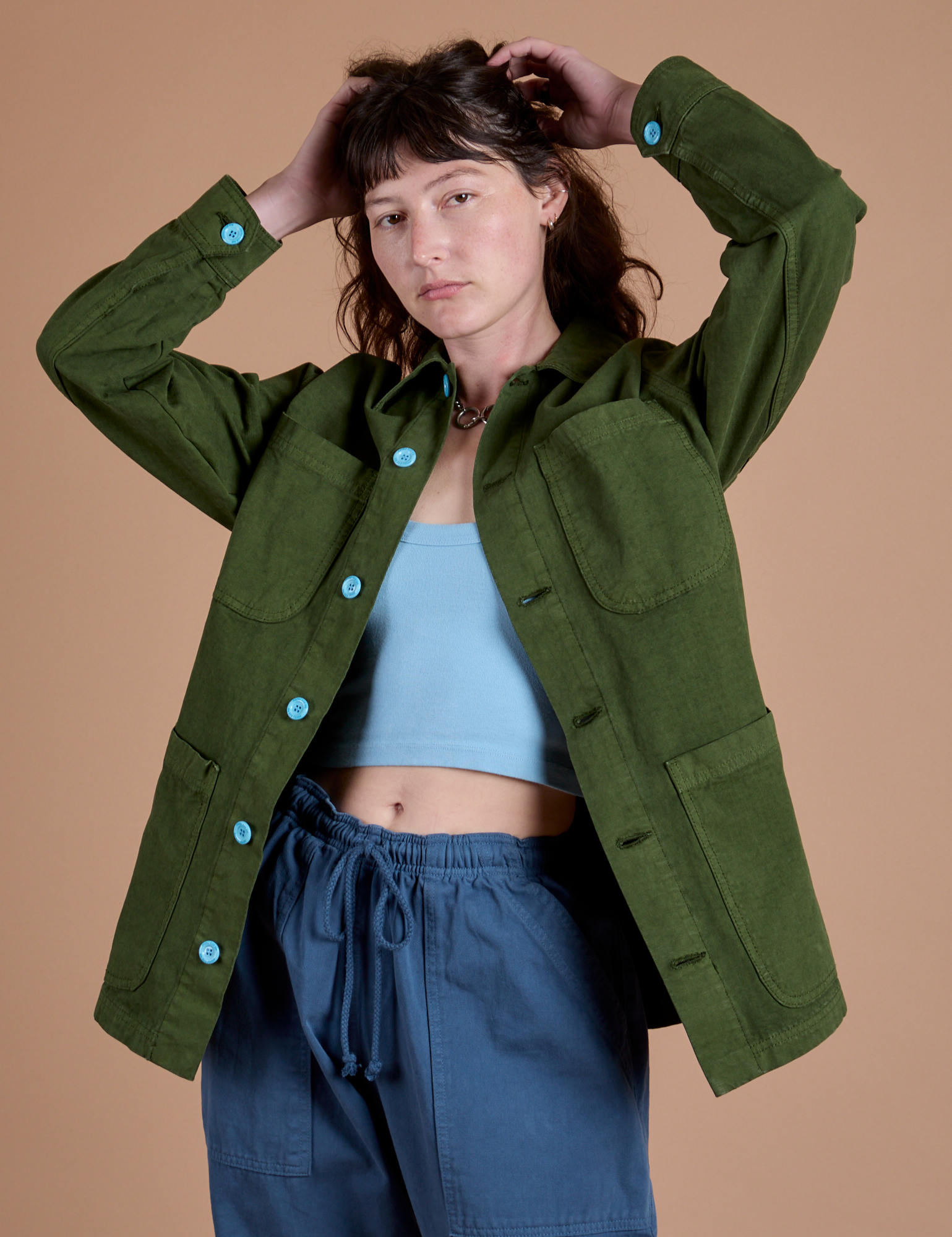Alex is wearing Ripstop Field Coat in Evergreen