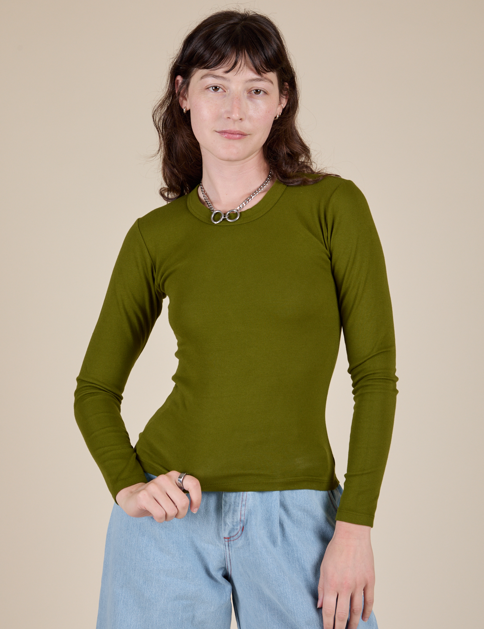 Alex is 5’8” and wearing P Long Sleeve Baby Tee in Summer Olive