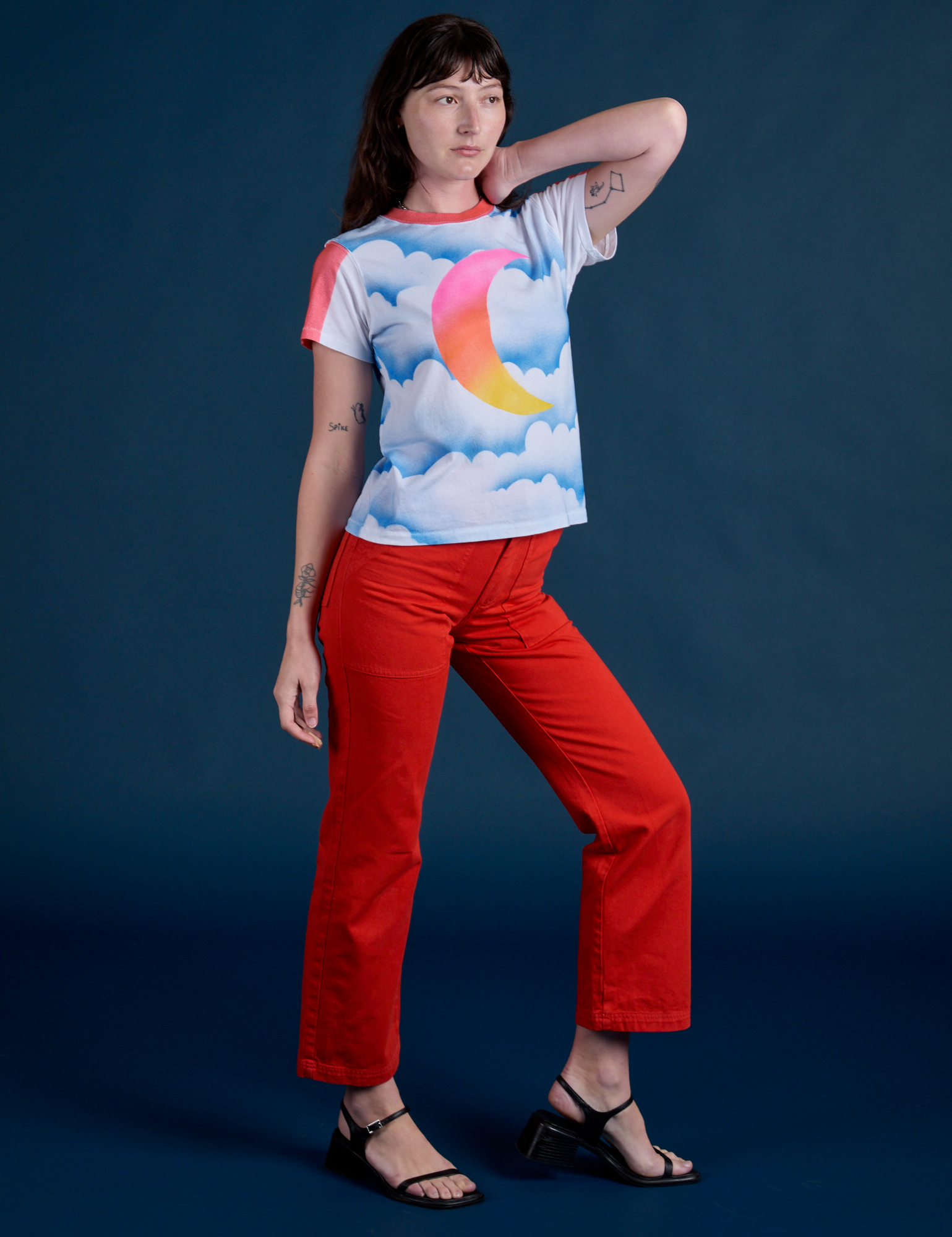 Alex is wearing Airbrush Moon Vintage Tee and mustang red Work Pants