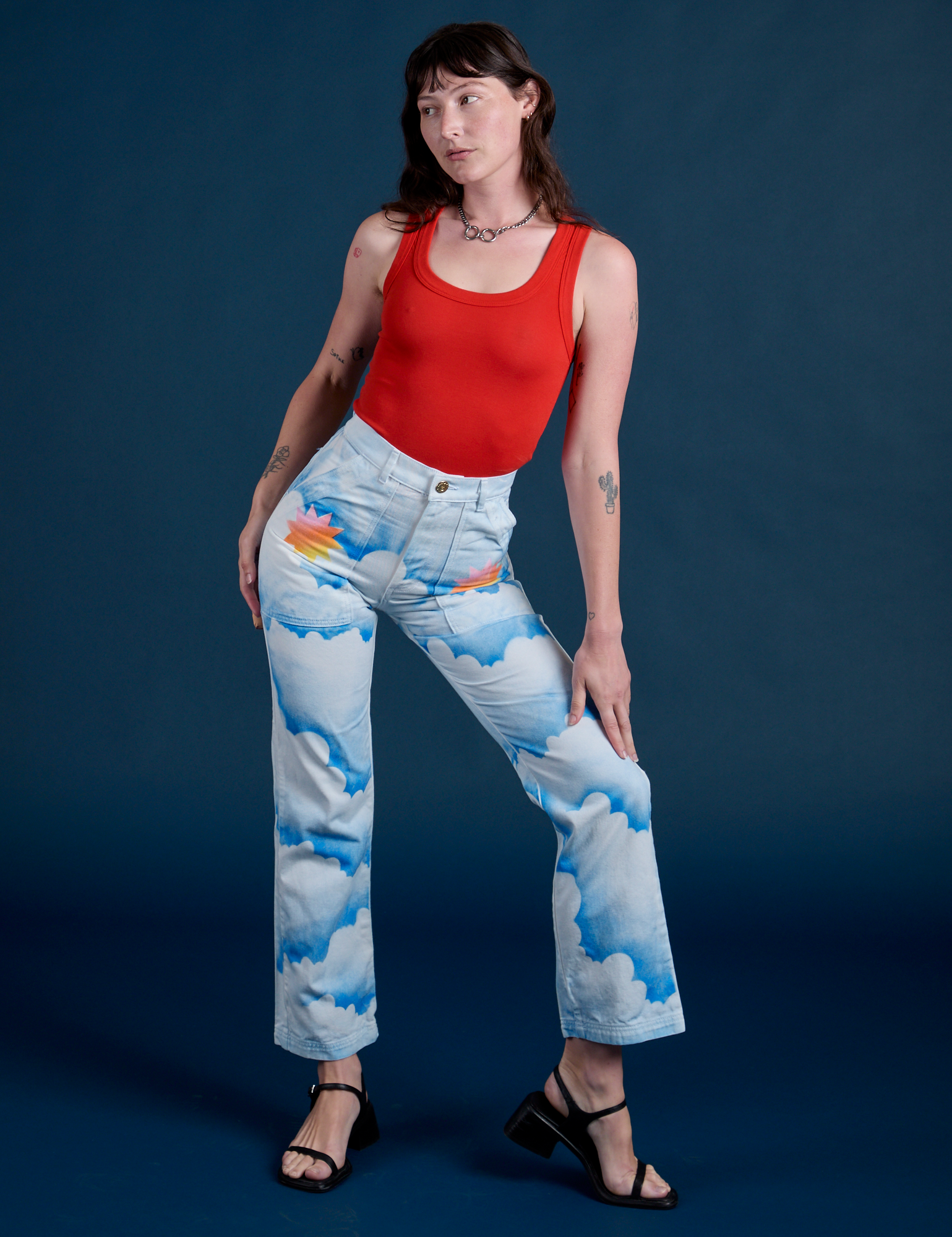 Work Pants in Sunny Cloud Airbrush and Tank Top in Mustang Red on Alex
