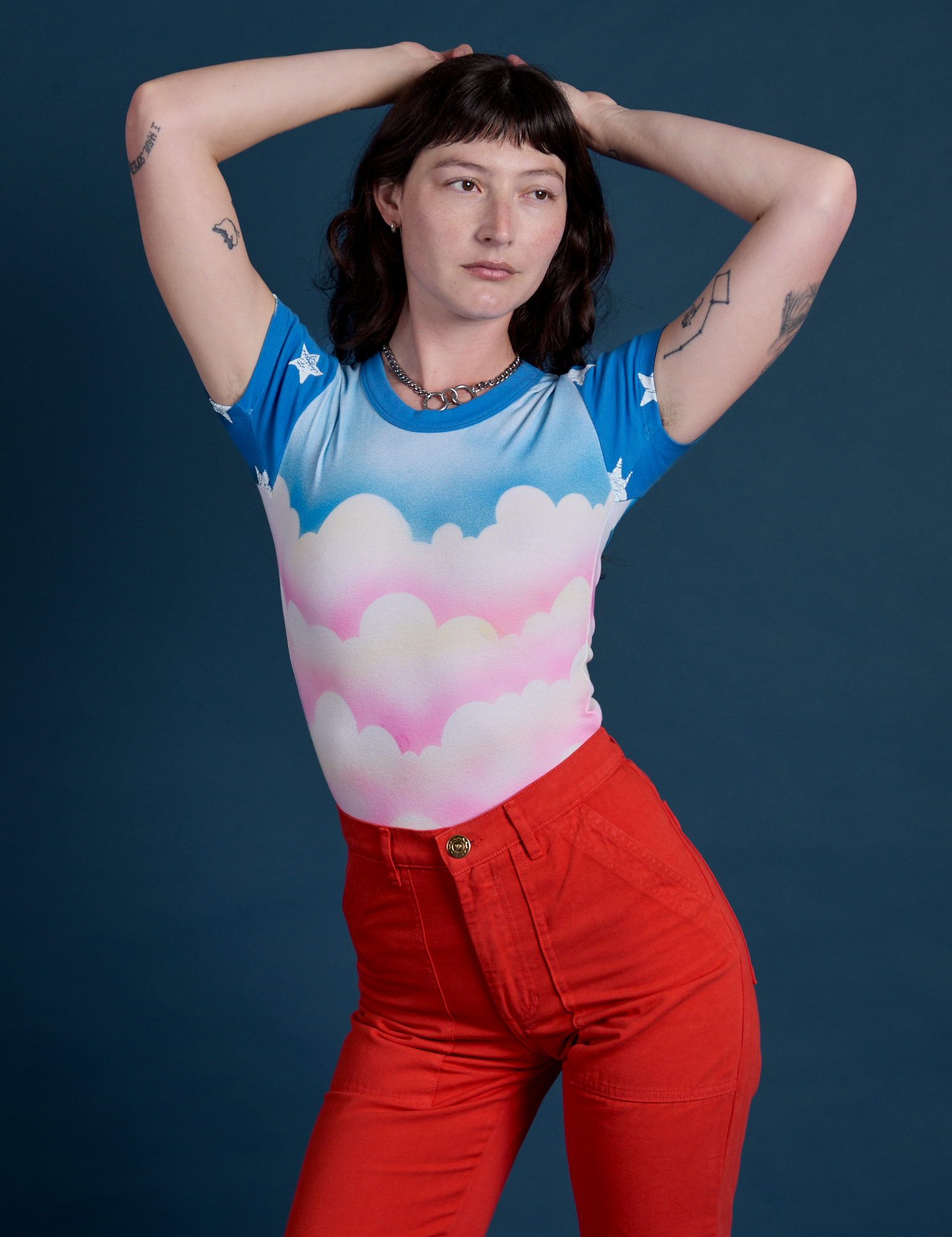 Airbrush Cloud Baby Tee on Alex tucked into mustang red Work Pants