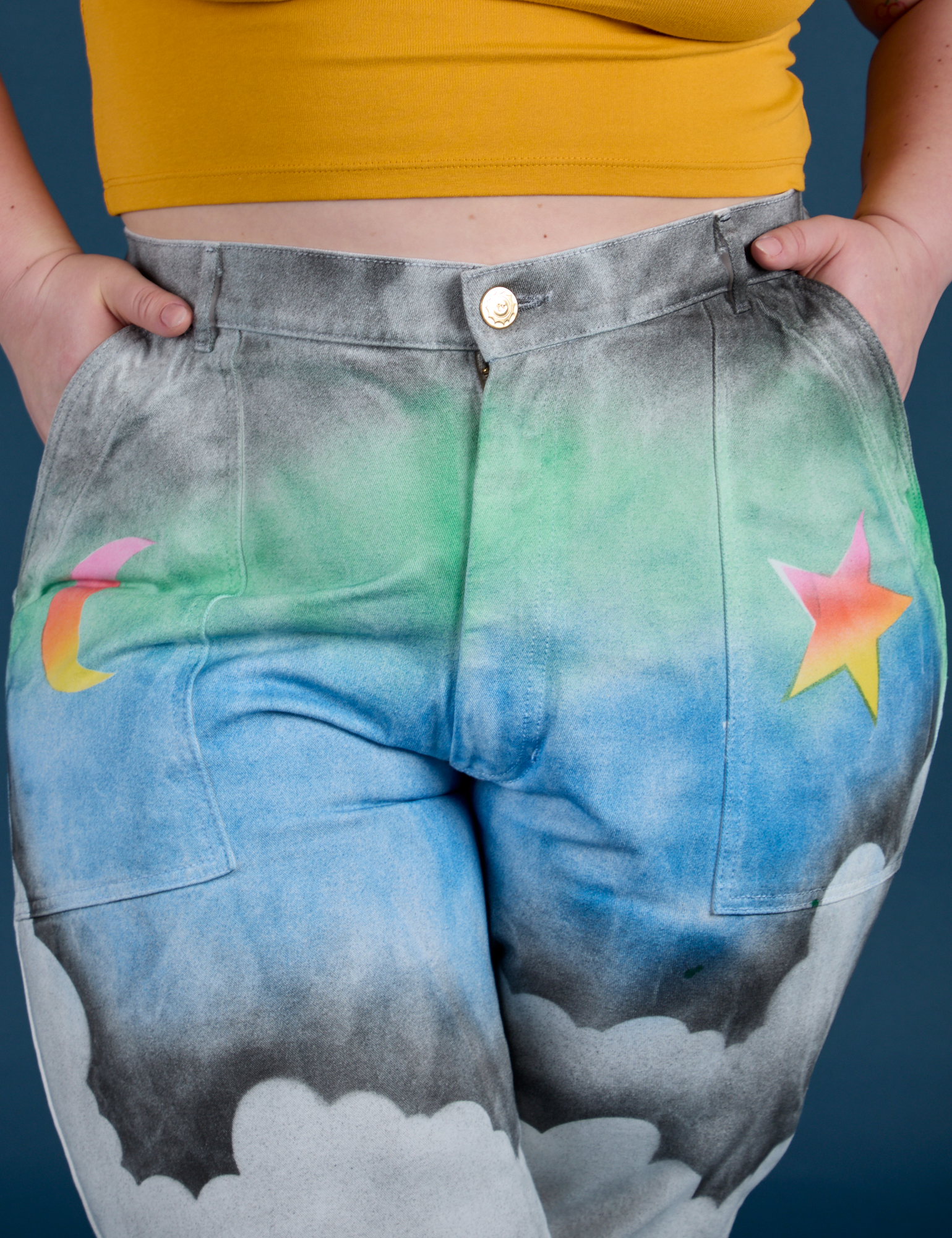 Work Pants in Night Sky Airbrush front close up with Ashley's hands in both pockets