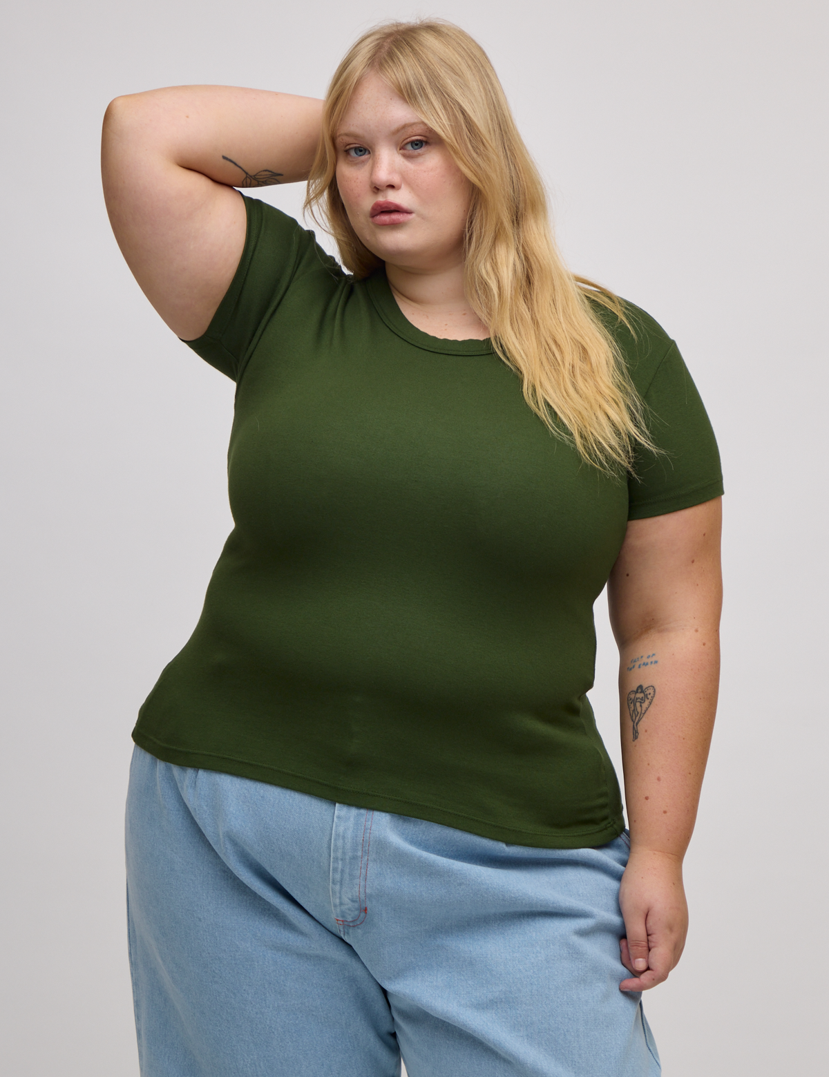 Juliet is wearing Baby Tee in Evergreen