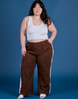 Ashley is wearing Painted Action Pants in Fudgesicle Brown and Cropped Tank in Vintage Tee White