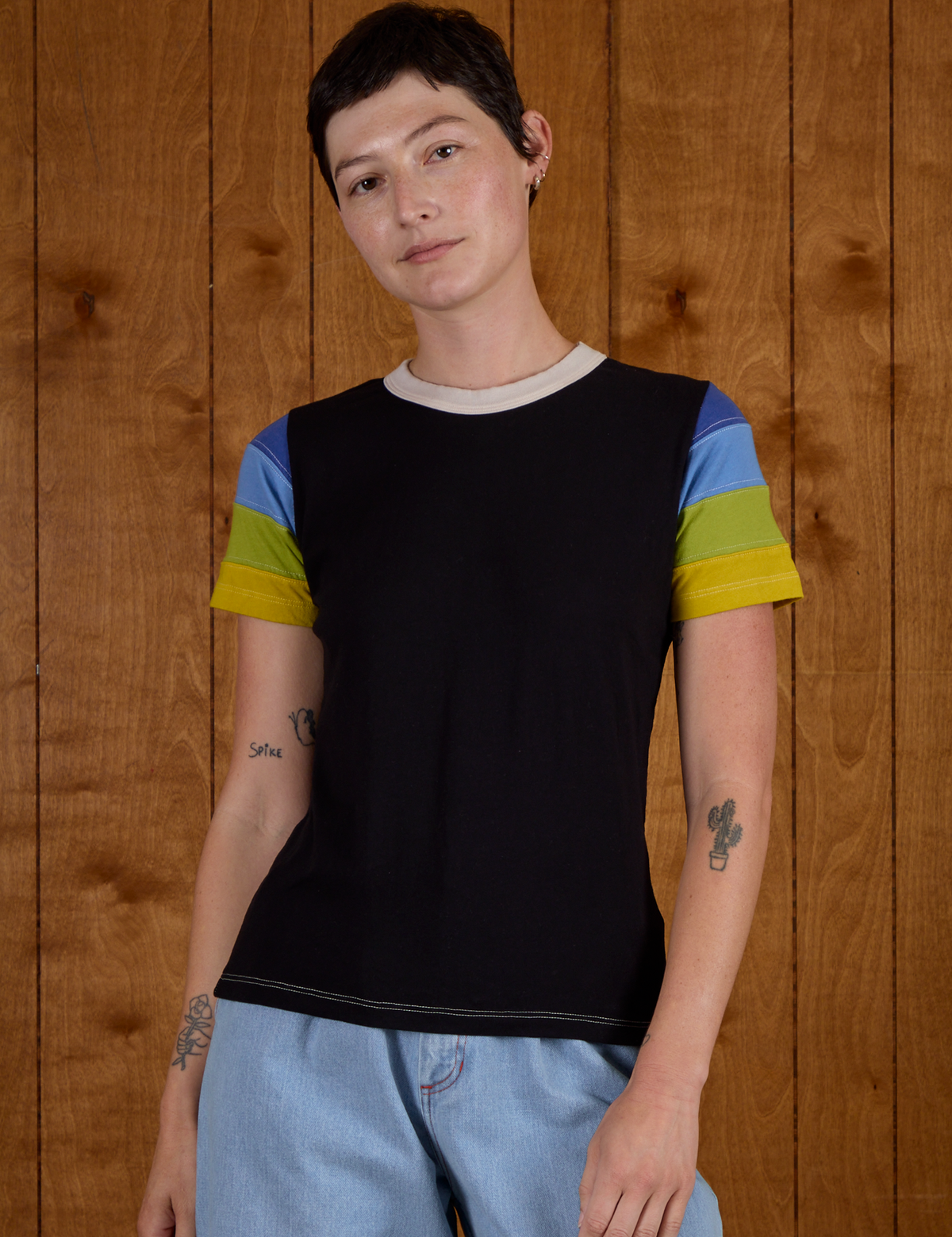 Alex is wearing Calypso Tee in Black Multi