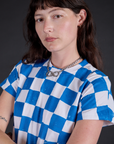 Angled front view close up of Checker Organic Tee in Blue on Alex
