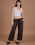 Alex is wearing Drop Pocket Cargo Pants in Espresso Brown and Cropped Tank in Vintage Tee White