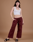 Alex is wearing Drop Pocket Cargo Pants in Red Wine and Cropped Tank in Vintage Tee White