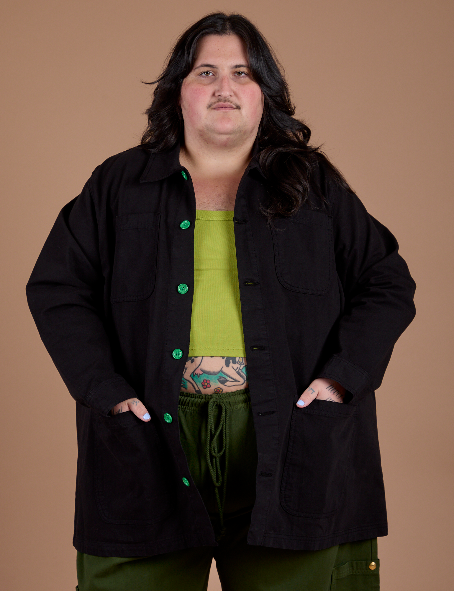 Sam is wearing Ripstop Field Coat in Basic Black